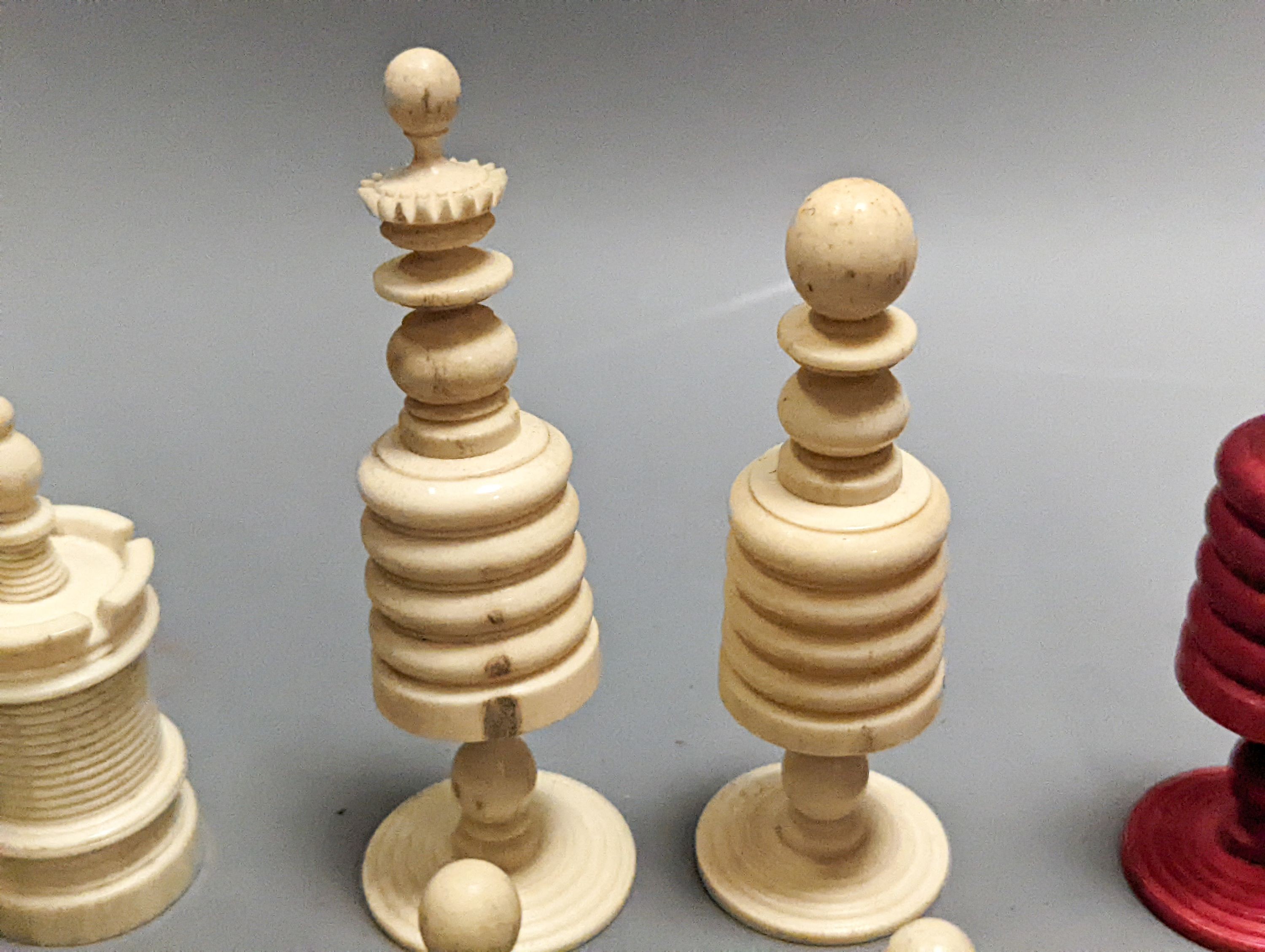 A 19th century turned ivory and bone chess set